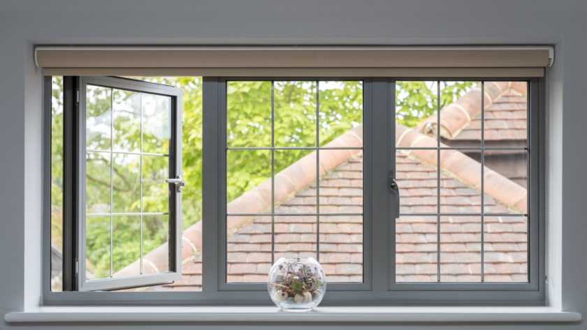 Classic-style cheap aluminium windows with grid pattern, offering clear outdoor views and natural ventilation.