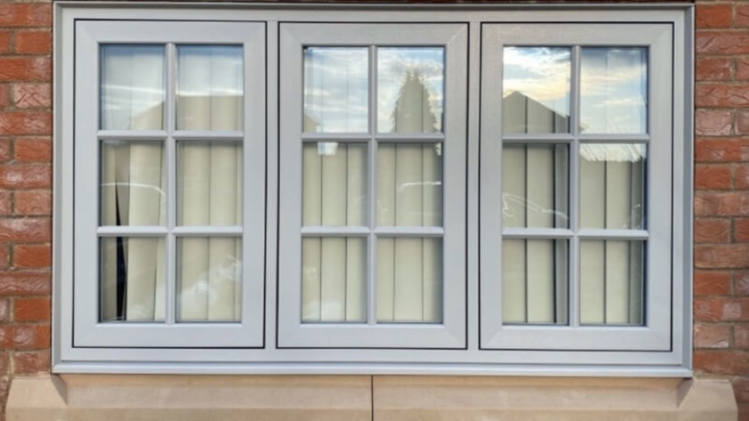 Sleek flush aluminium windows installed on a modern brick house