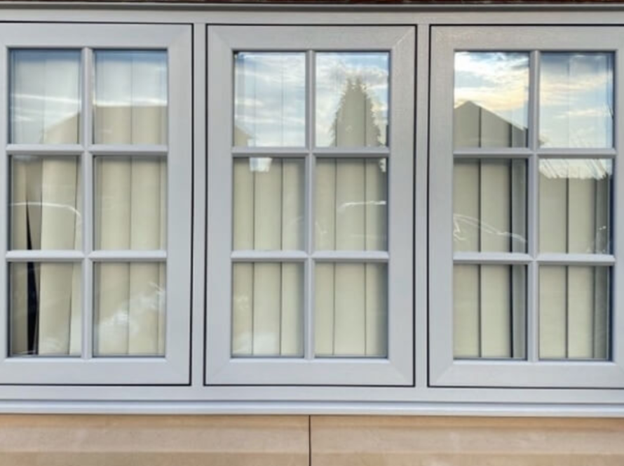 Sleek flush aluminium windows installed on a modern brick house