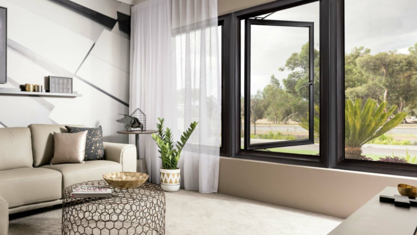 Modern living room featuring elegant PTT aluminium windows with expansive glass areas and sleek frames