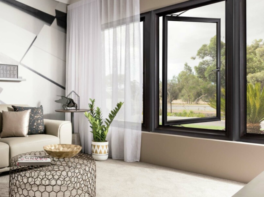 Modern living room featuring elegant PTT aluminium windows with expansive glass areas and sleek frames
