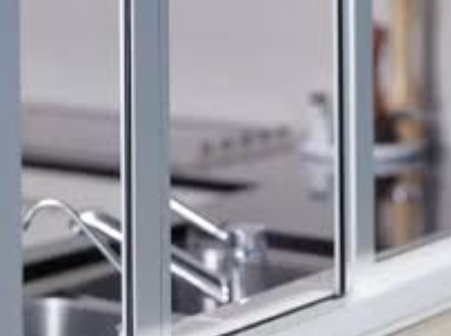 Modern kitchen featuring sleek silver aluminium window frames