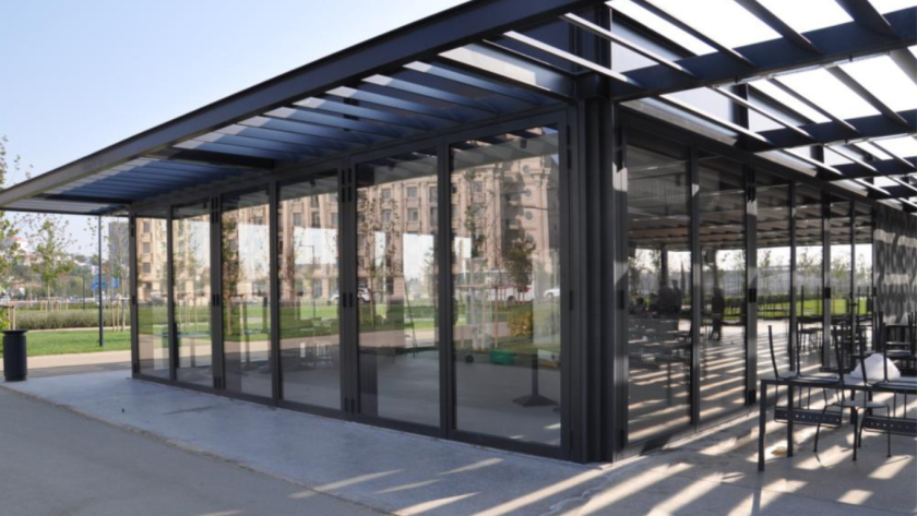 Modern building with floor-to-ceiling thermal break aluminium windows and doors, providing energy-efficient insulation and sleek architectural design