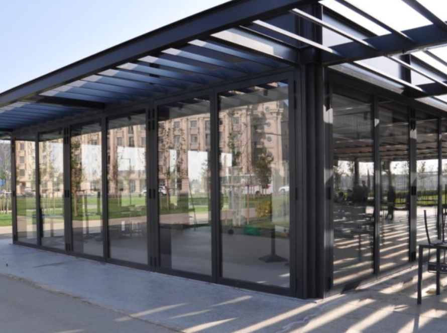 Modern building with floor-to-ceiling thermal break aluminium windows and doors, providing energy-efficient insulation and sleek architectural design