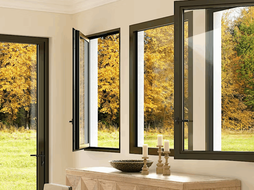 Tilt and turn double glazing windows with dark aluminium frames, partially open to reveal autumn landscape, blending energy efficiency with interior elegance