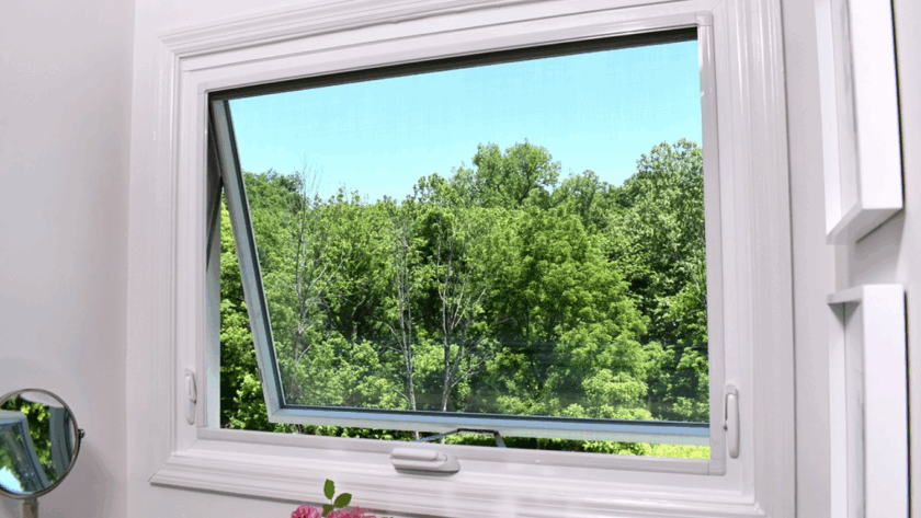 Open white casement window providing fresh air and scenic views of green trees