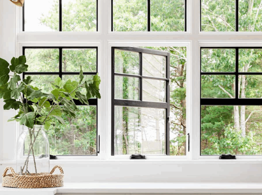 Modern double hung windows replacing traditional casement windows, providing bright natural lighting and garden views