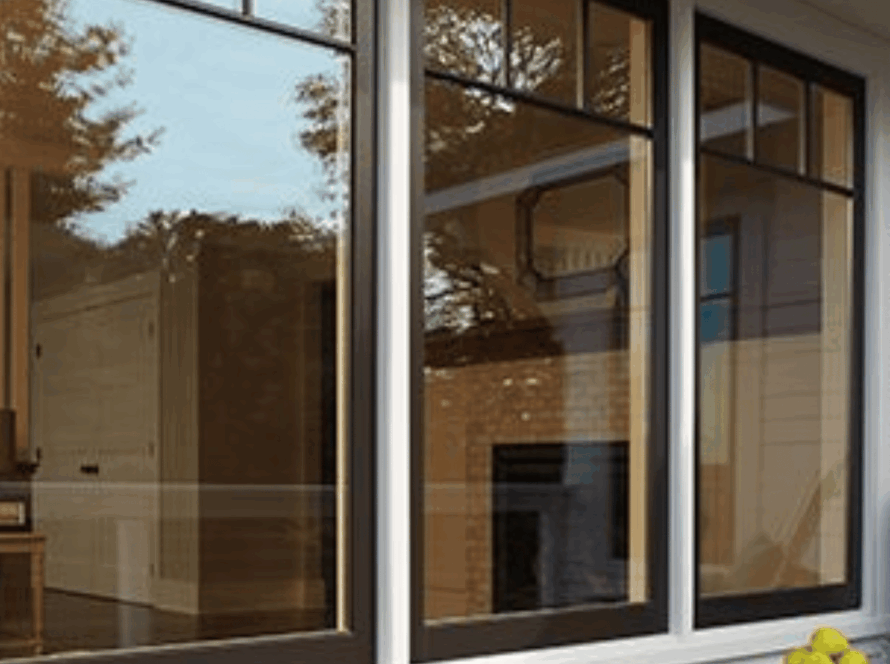 Modern colored casement windows in anthracite grey installed in a cozy suburban home