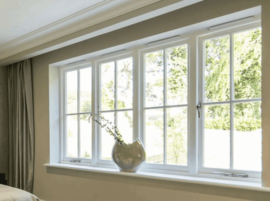 Bright and stylish European casement windows overlooking a sunny, green garden