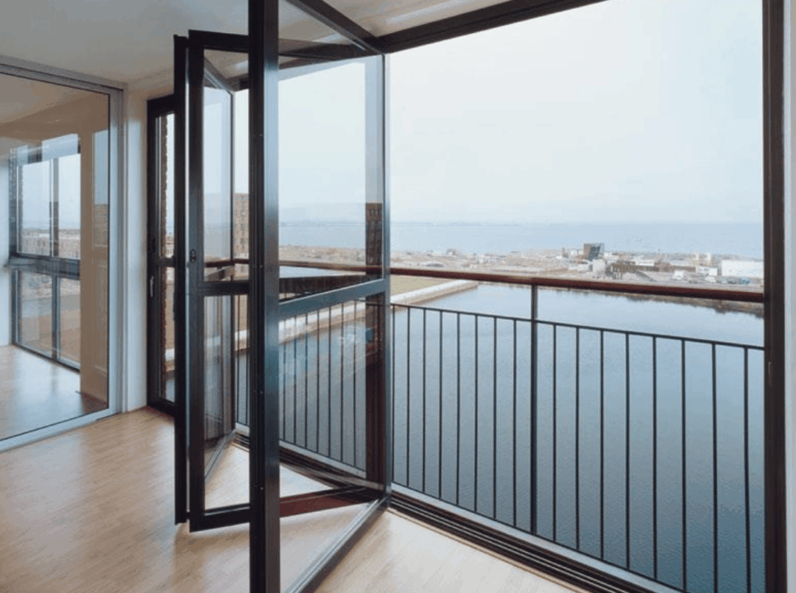 Balcony featuring modern aluminium sliding windows overlooking a waterfront view