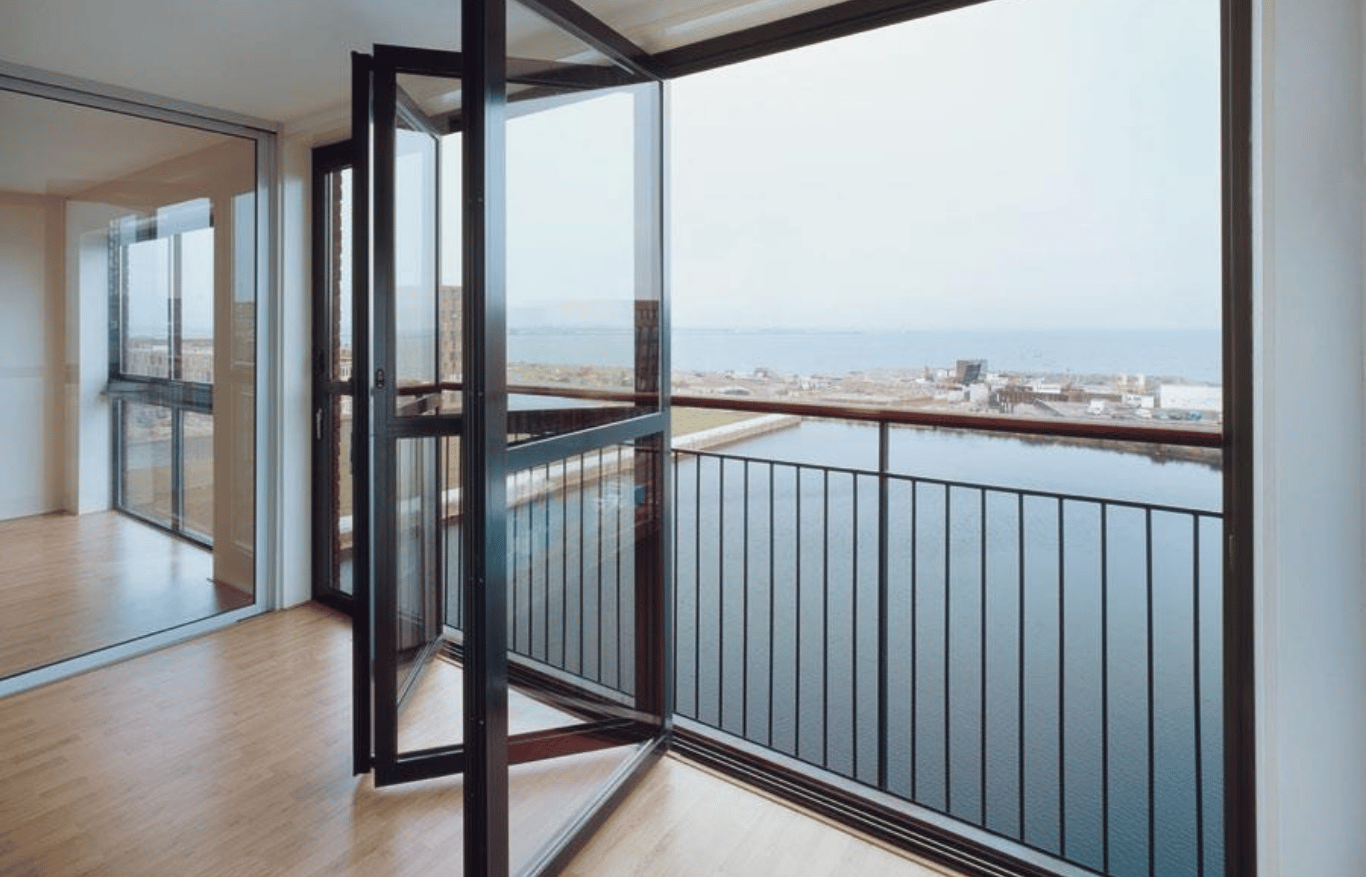 Balcony featuring modern aluminium sliding windows overlooking a waterfront view
