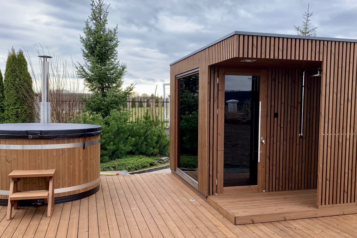 Thermowood outdoor sauna and hot tub on wooden garden deck