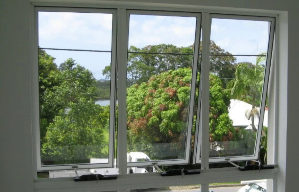Aluminium awning windows open outward with green garden view