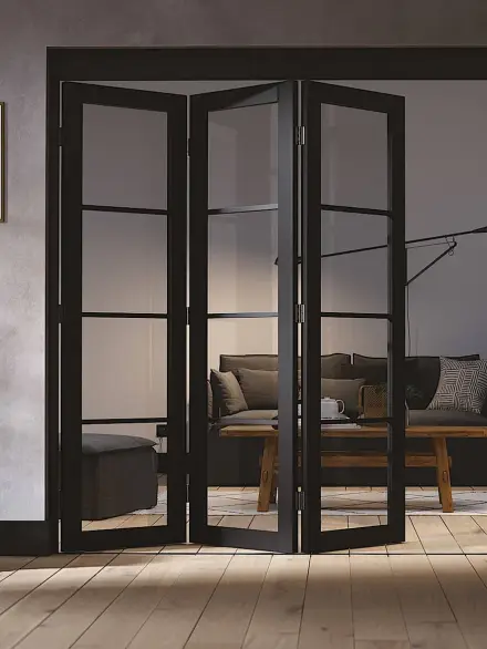 fold-001 Interior black-framed aluminium folding doors partially opened between two rooms with modern decor.